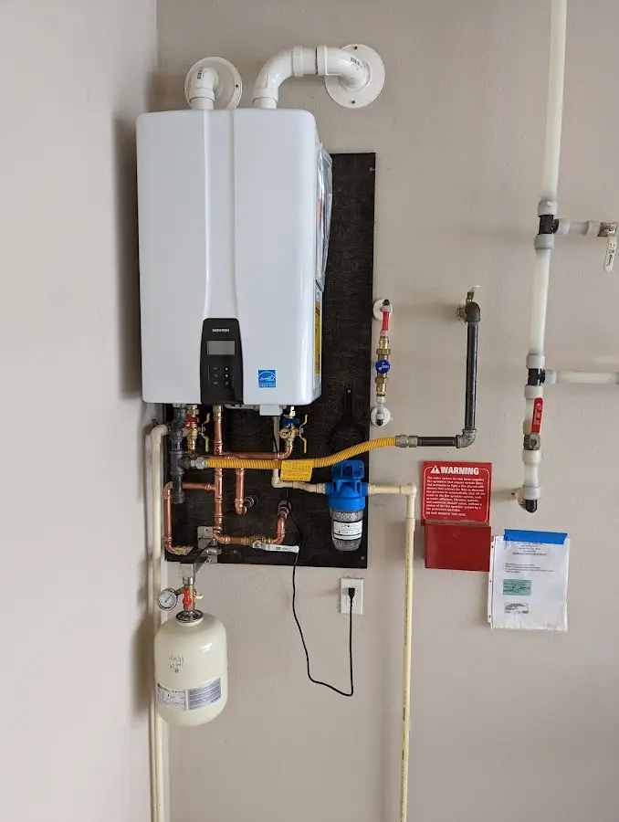 Professional plumber installing copper piping in a Ashdown home